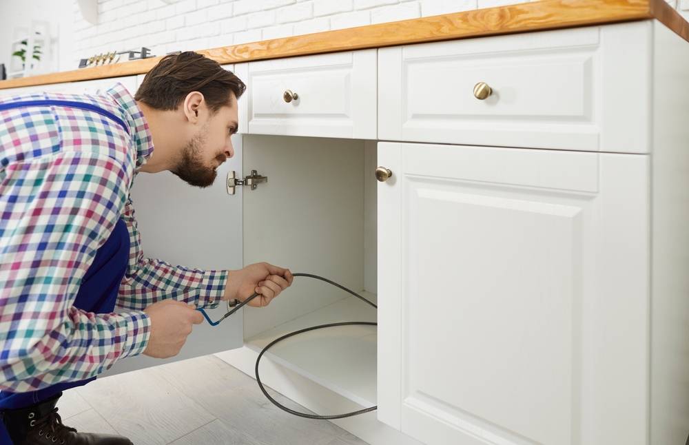 plumbing snaking a drain