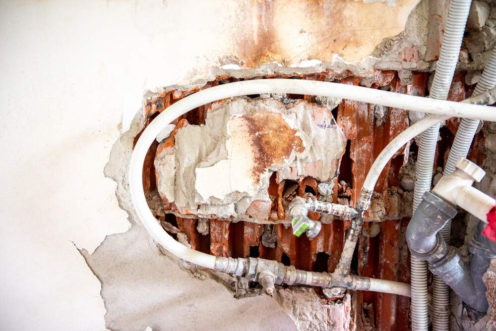 damaged wall plumbing system